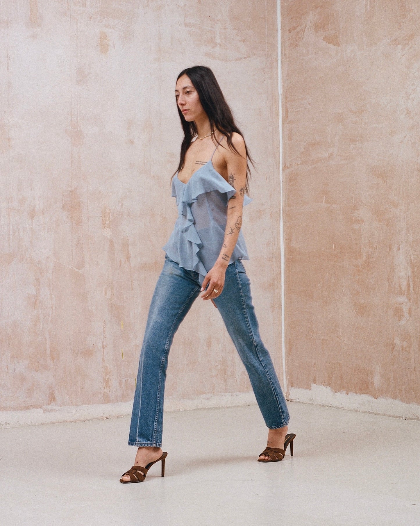 Pale blue ruffle front silk cami top