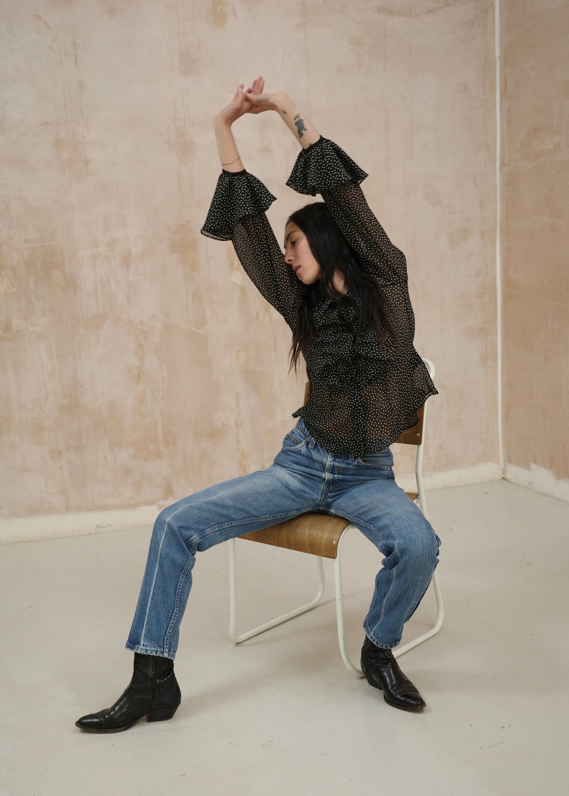 Black and white polka dot spot ruffle blouse with frill cuff