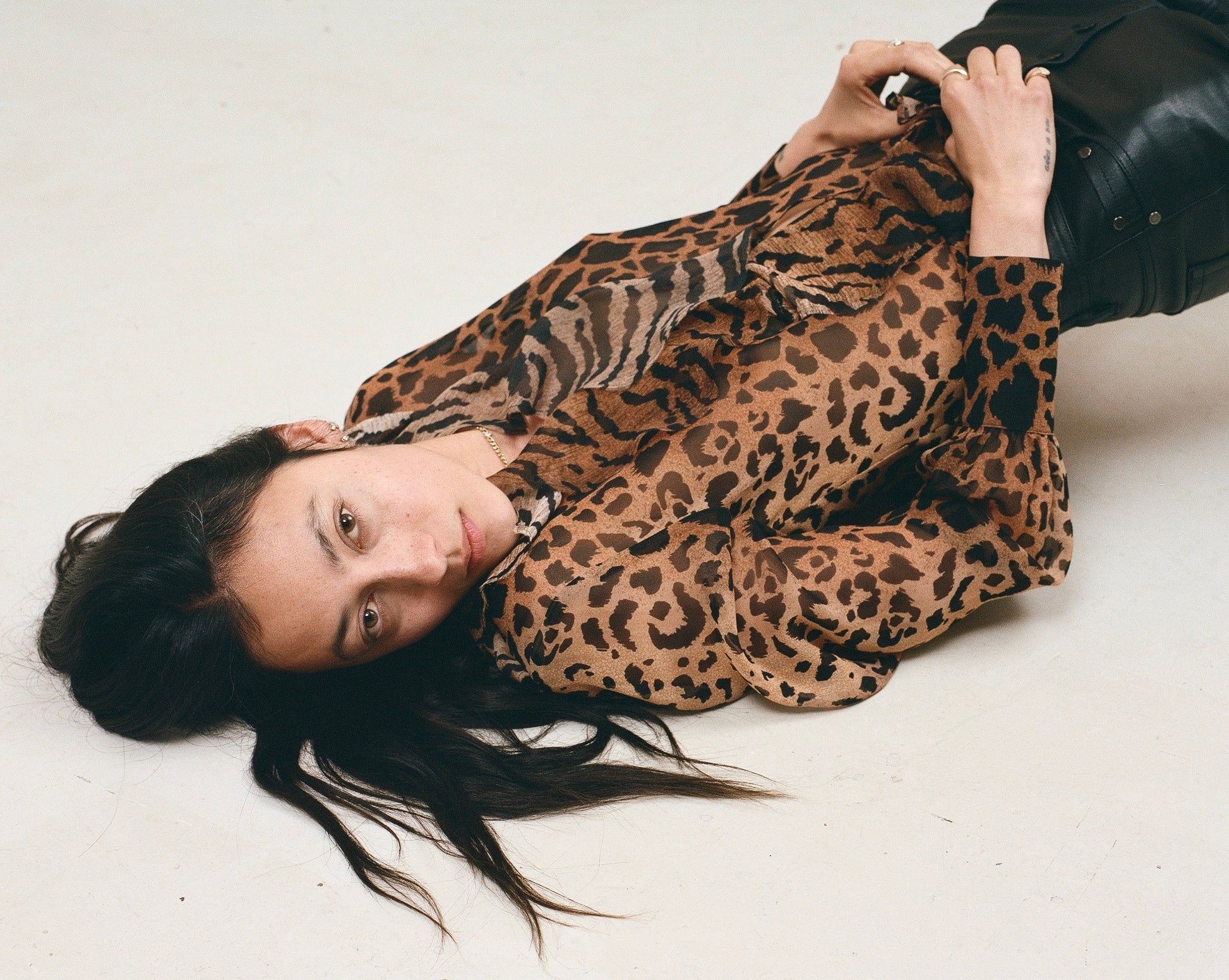 Leopard print silk blouse with ruffle front and button through opening
