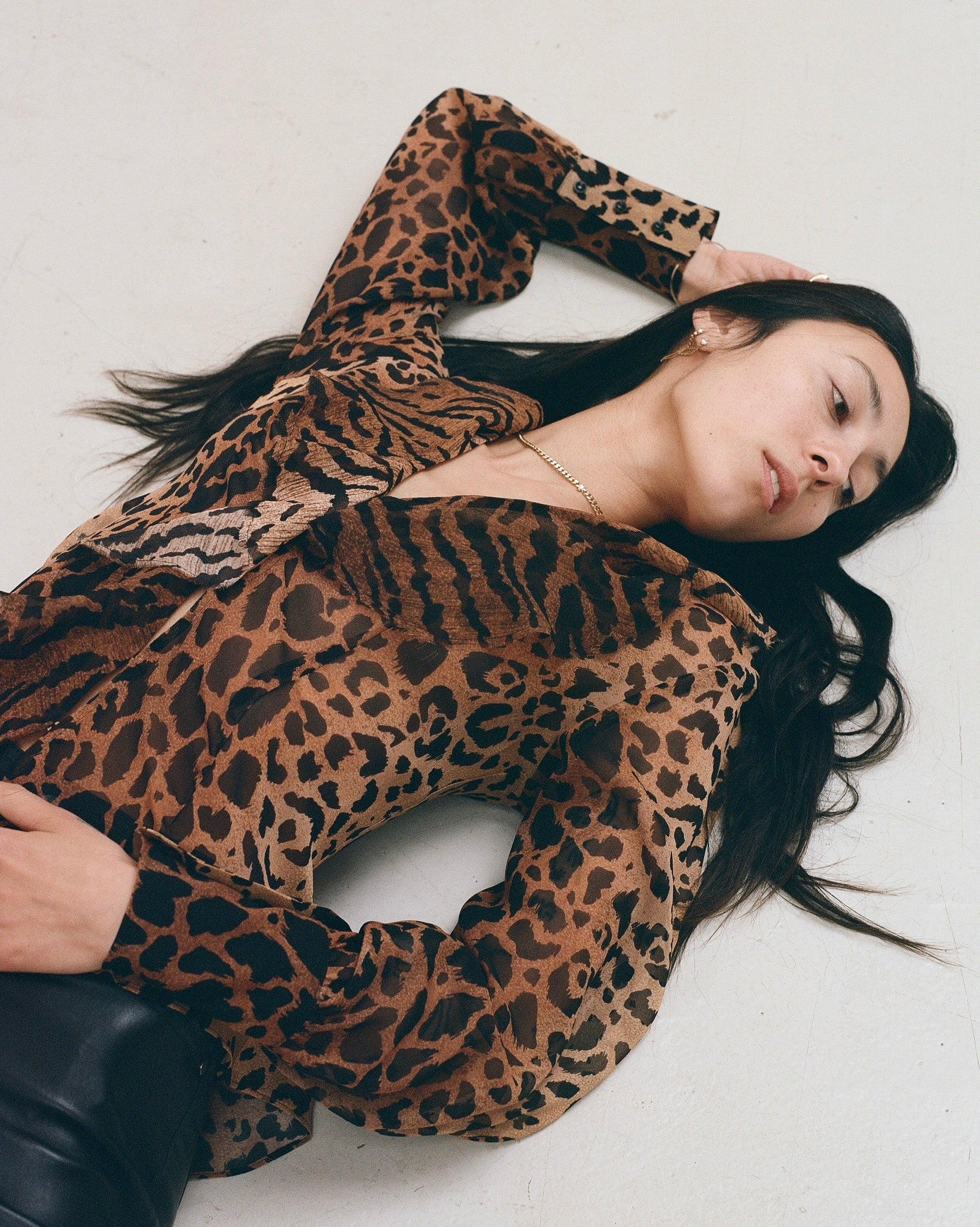 Leopard print silk blouse with ruffle front and button through opening